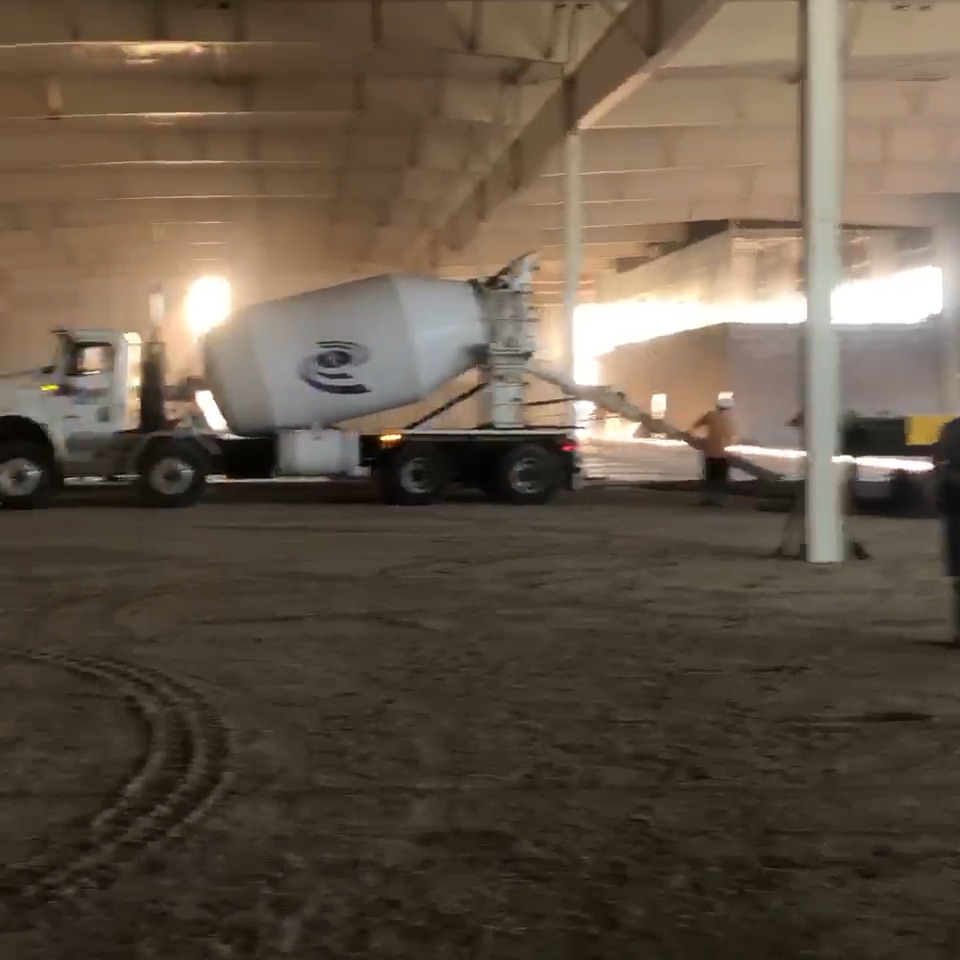 A cement truck in a big building